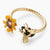 LES NEREIDES BUTTERCUP AND BEE TWISTED ADJUSTABLE RING